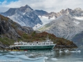 UnCruise Ship with Fairweather Mountains in background in Glacier Bay National Park